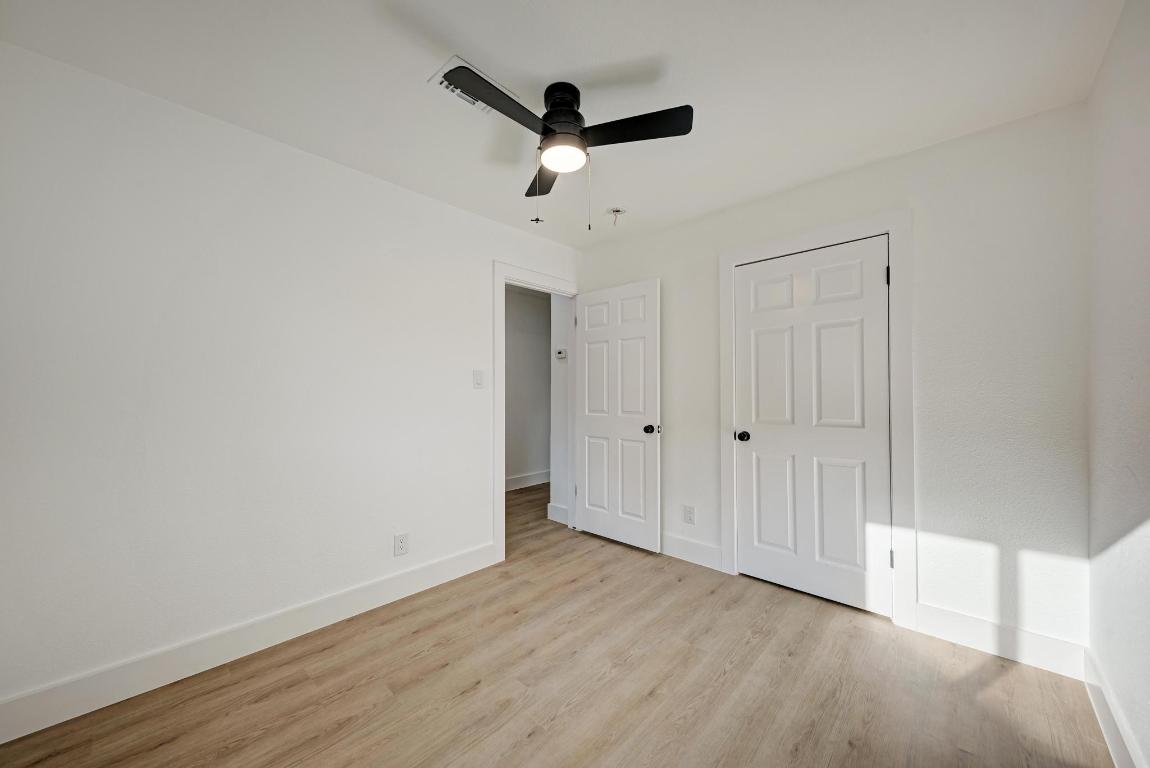 5106 Regency Drive Austin, TX 78724 - Photo 22 of 37 a view of empty room with wooden floor