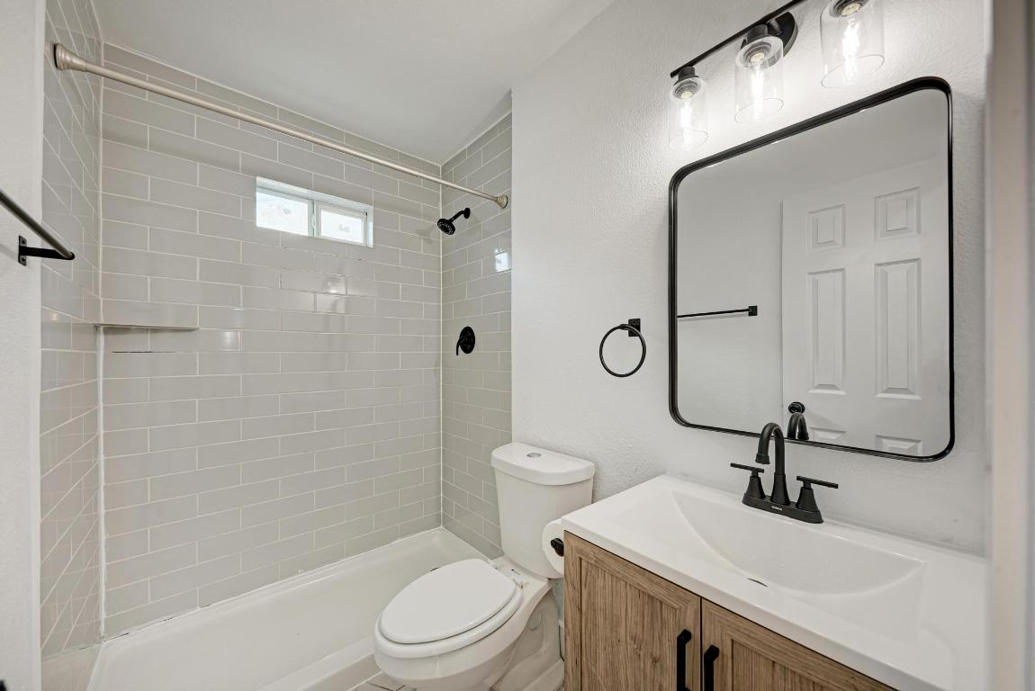 5106 Regency Drive Austin, TX 78724 - Photo 23 of 37 a bathroom with a sink a toilet and shower