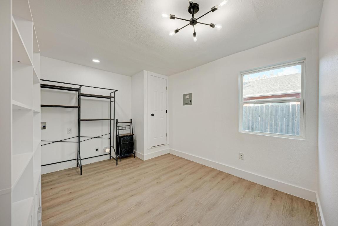 5106 Regency Drive Austin, TX 78724 - Photo 28 of 37 a view of empty room with wooden floor and window
