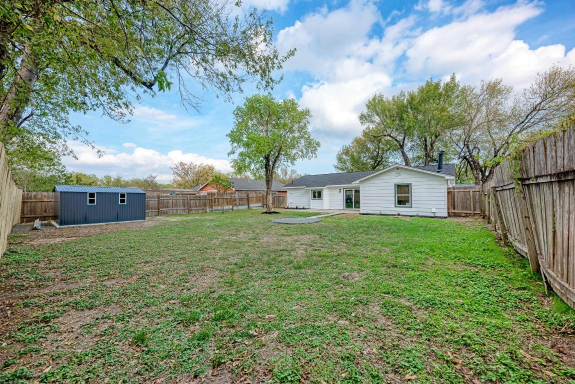 5106 Regency Drive Austin, TX 78724 - Photo 34 of 37 a view of a yard in front of a house with a large tree