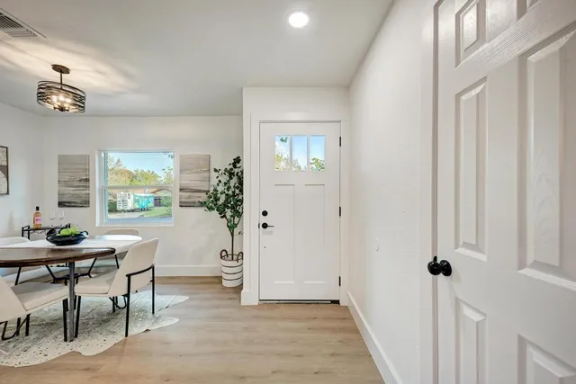a view of a livingroom with furniture and a window