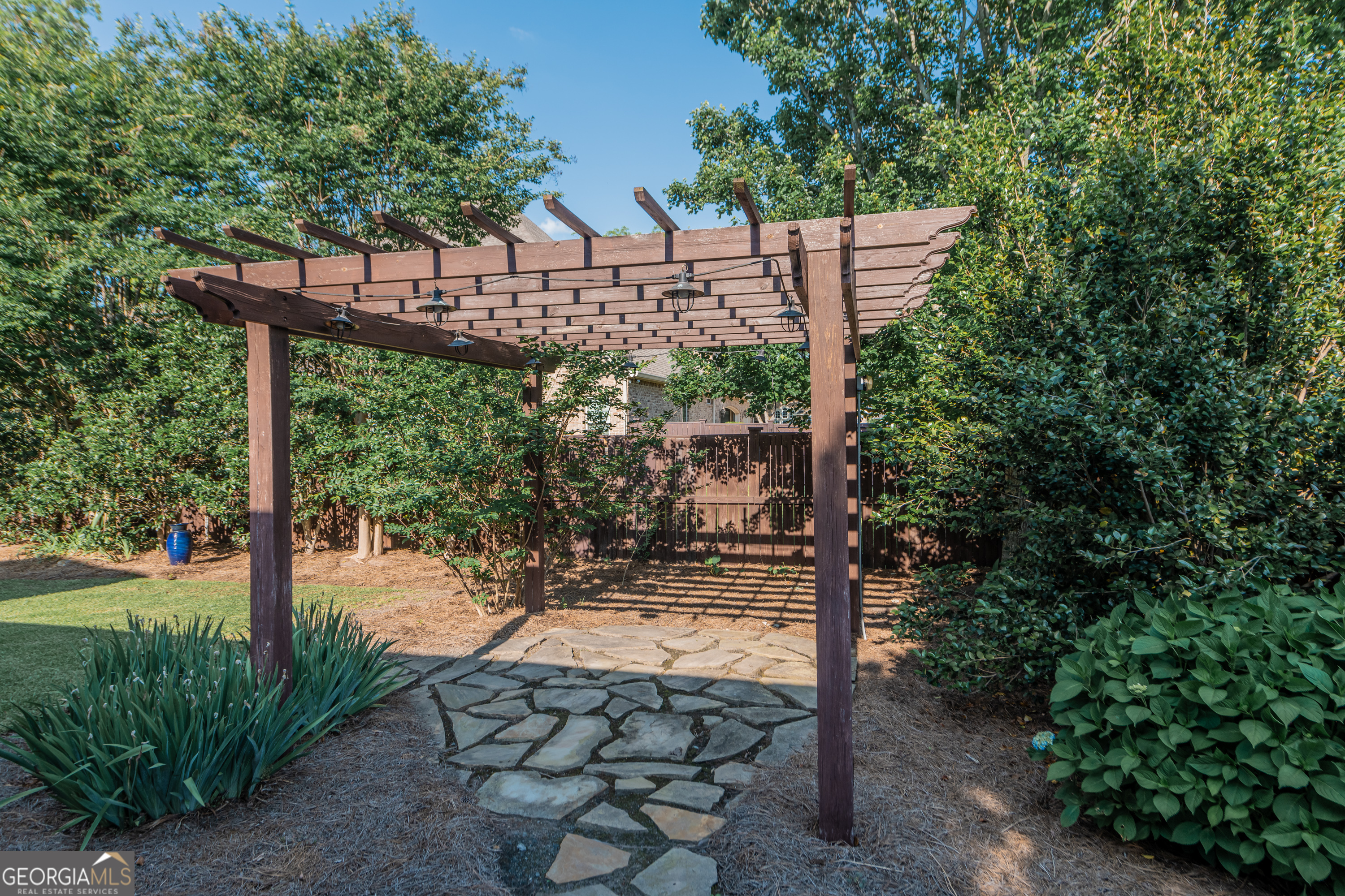 405 Old Bridge Road Warner Robins, GA 31088 - Photo 52 of 55 a view of a pathway with a tree in front of it