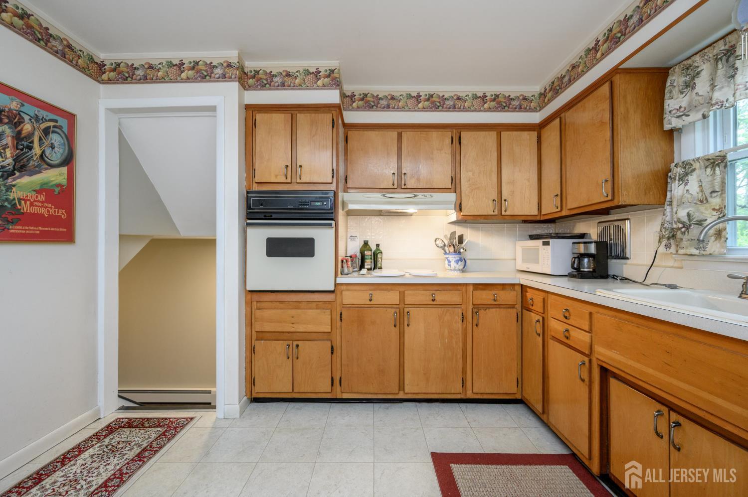 5 Locust Street Netcong, NJ 07857 - Photo 11 of 34 a kitchen with stainless steel appliances a stove a sink and a refrigerator