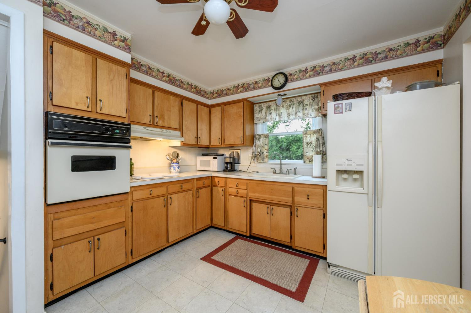 5 Locust Street Netcong, NJ 07857 - Photo 12 of 34 a kitchen with stainless steel appliances a refrigerator sink and cabinets