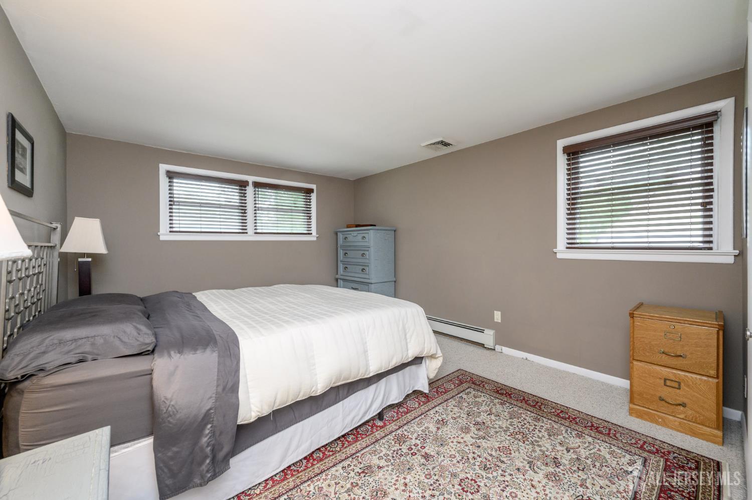 5 Locust Street Netcong, NJ 07857 - Photo 14 of 34 a bedroom with a bed and wooden floor