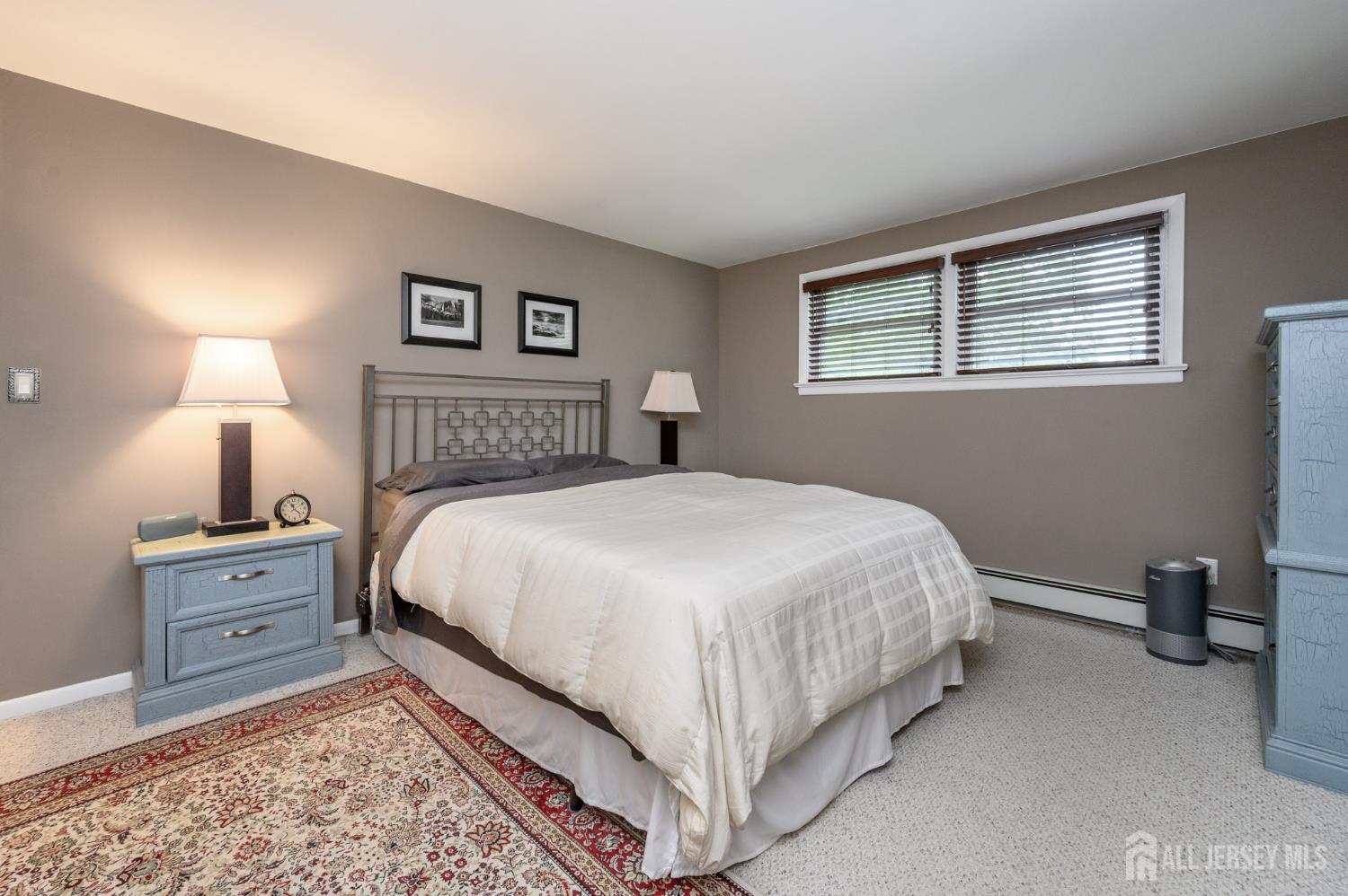 5 Locust Street Netcong, NJ 07857 - Photo 15 of 34 a bedroom with a bed and a lamp with window