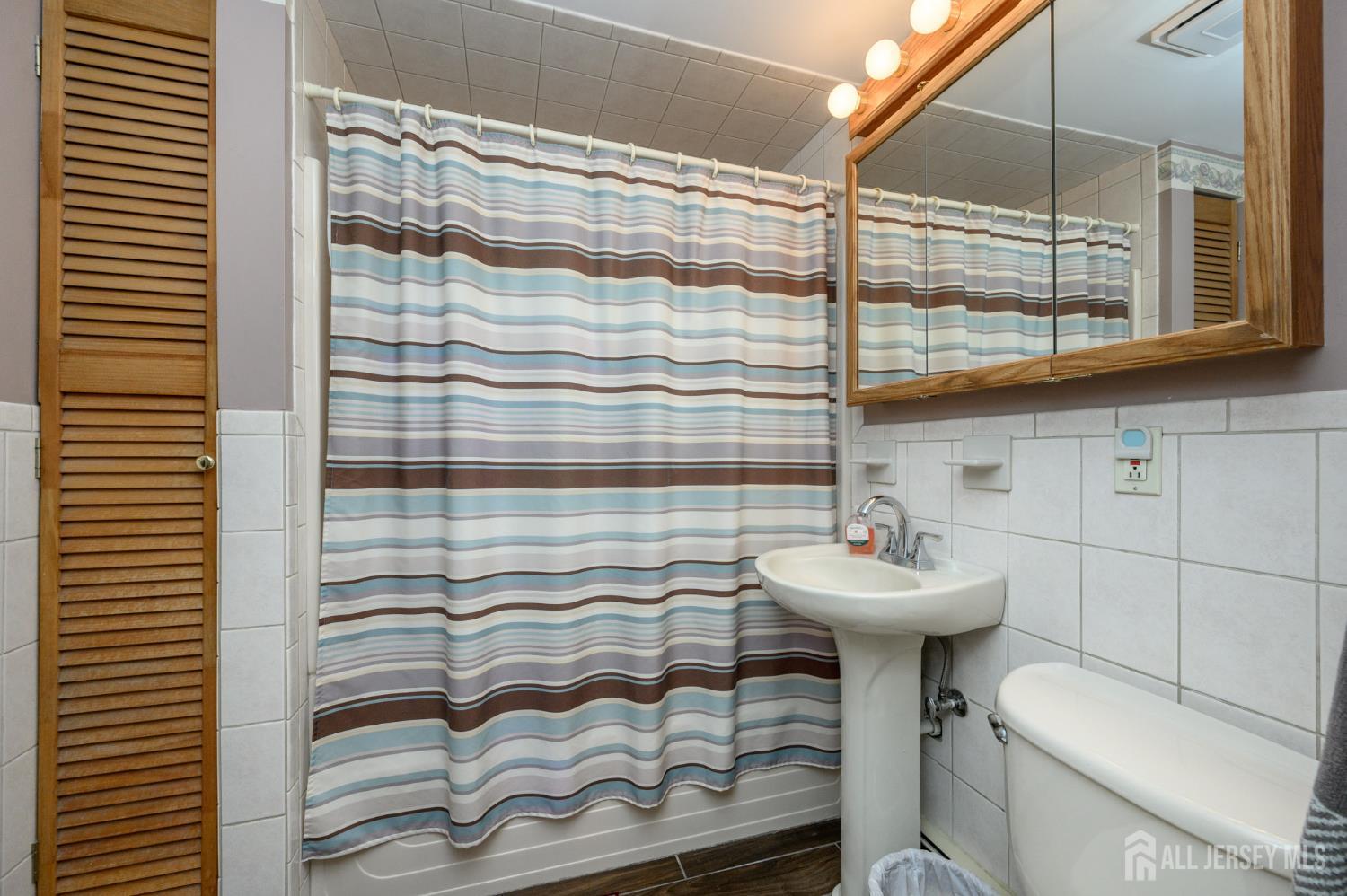 5 Locust Street Netcong, NJ 07857 - Photo 19 of 34 a bathroom with a sink toilet and shower