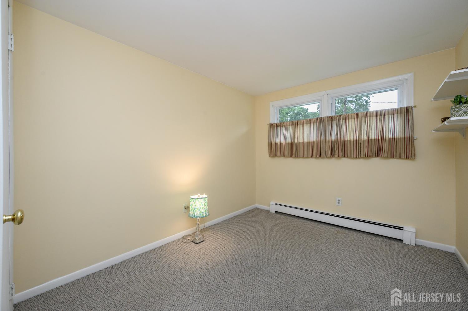 5 Locust Street Netcong, NJ 07857 - Photo 20 of 34 an empty room with a empty space and windows