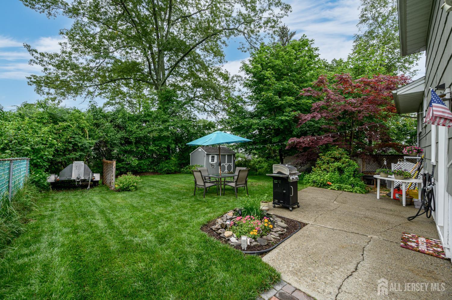5 Locust Street Netcong, NJ 07857 - Photo 25 of 34 a view of a garden with plants and a bench