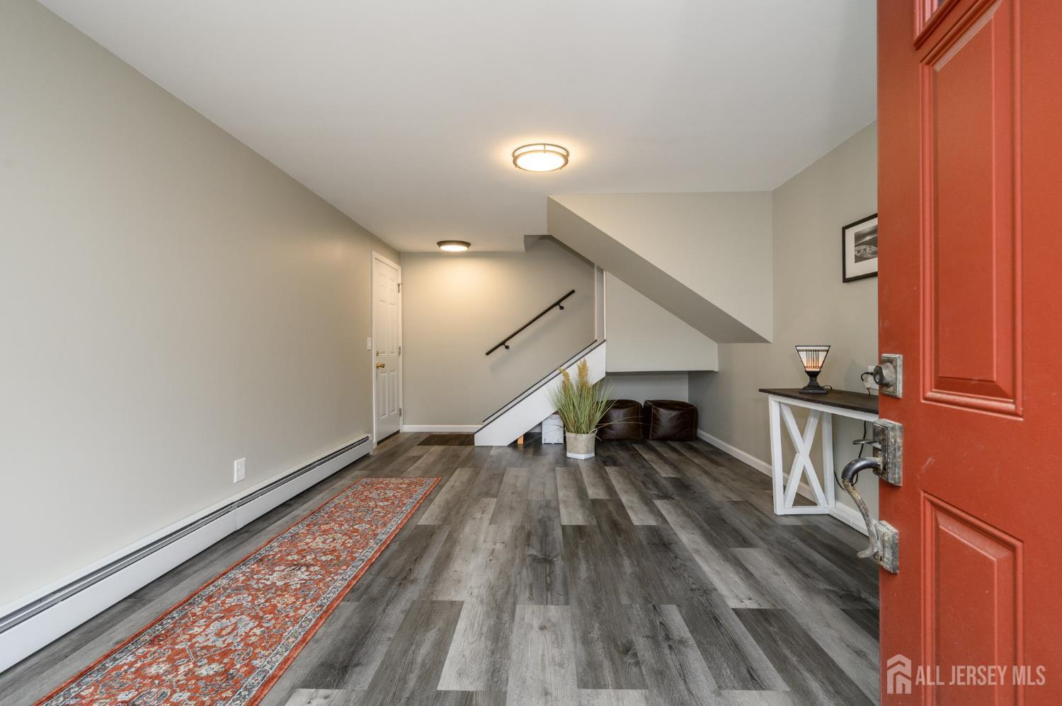 5 Locust Street Netcong, NJ 07857 - Photo 3 of 34 a view of entryway and hall with wooden floor