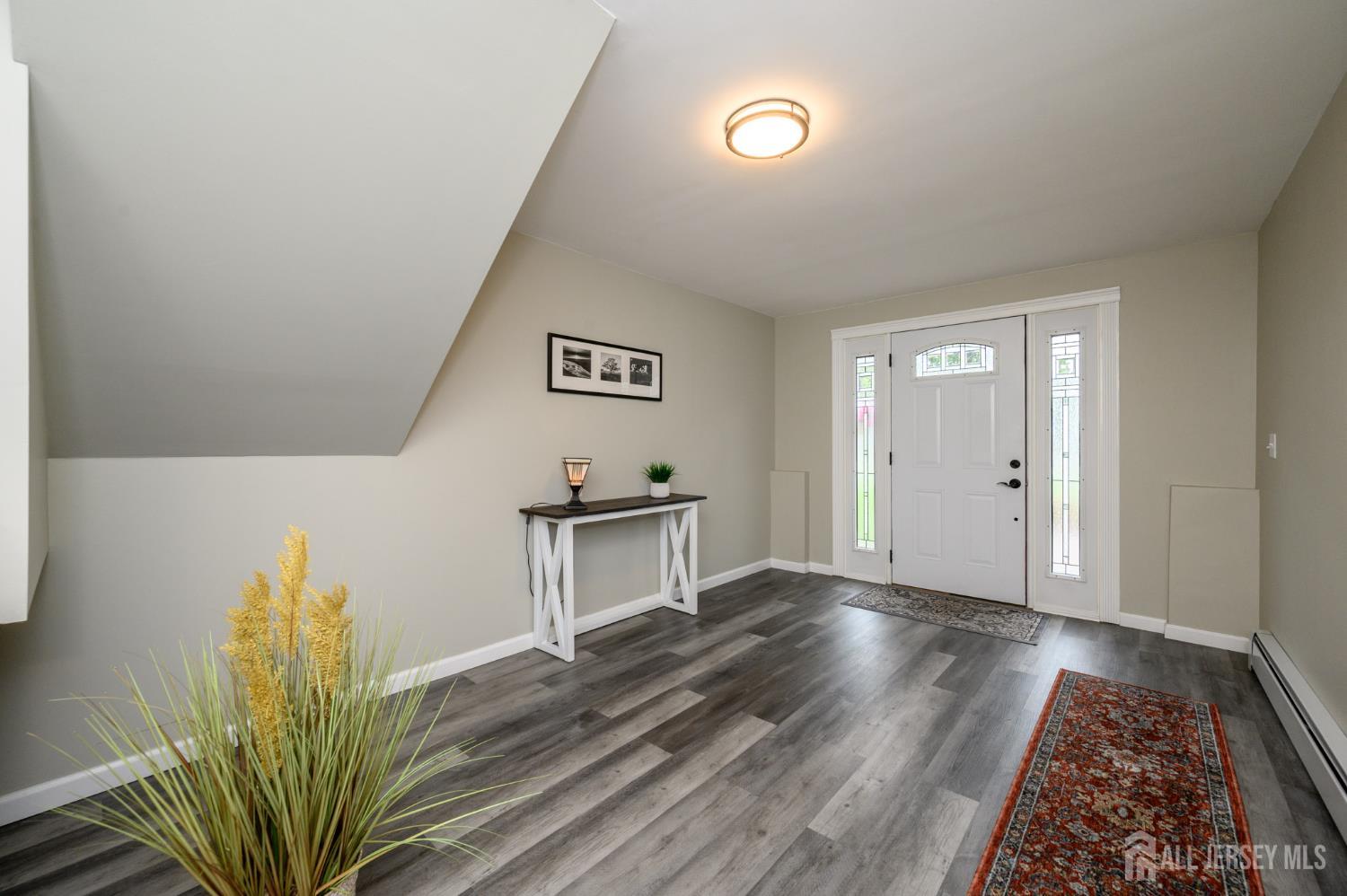 5 Locust Street Netcong, NJ 07857 - Photo 4 of 34 a view of a hallway to a livingroom with furniture