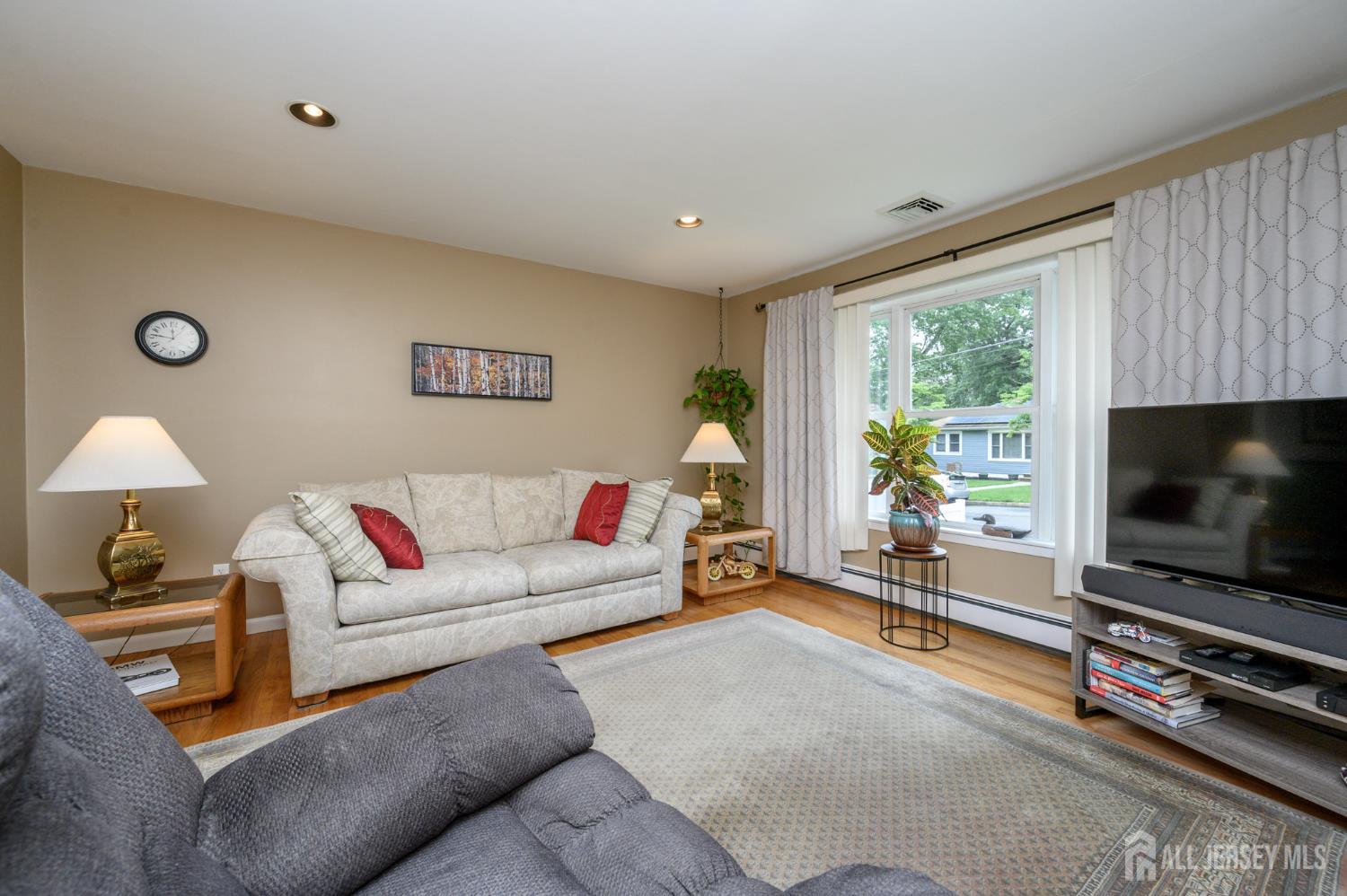 5 Locust Street Netcong, NJ 07857 - Photo 6 of 34 a living room with furniture and a flat screen tv