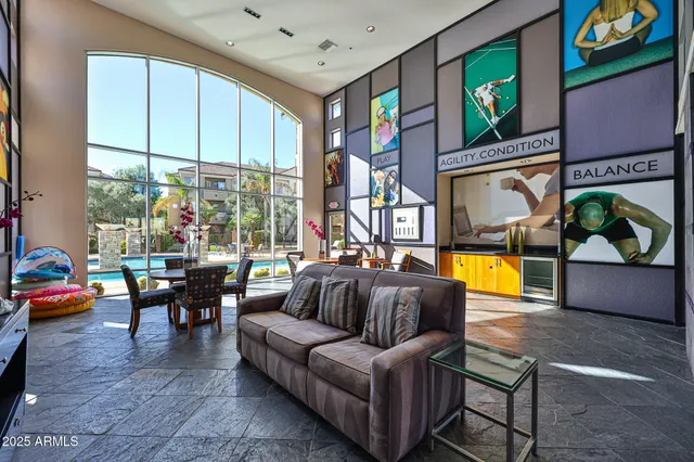 a living room with furniture and a large window