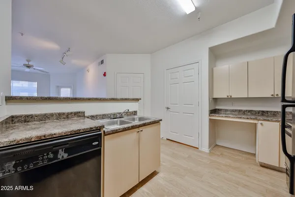 a kitchen with a stove and a refrigerator