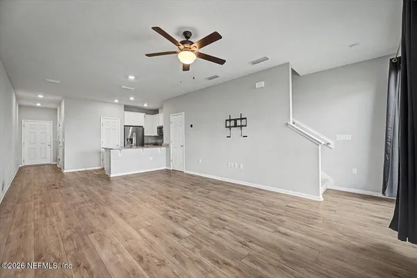 an empty room with a empty space and a window