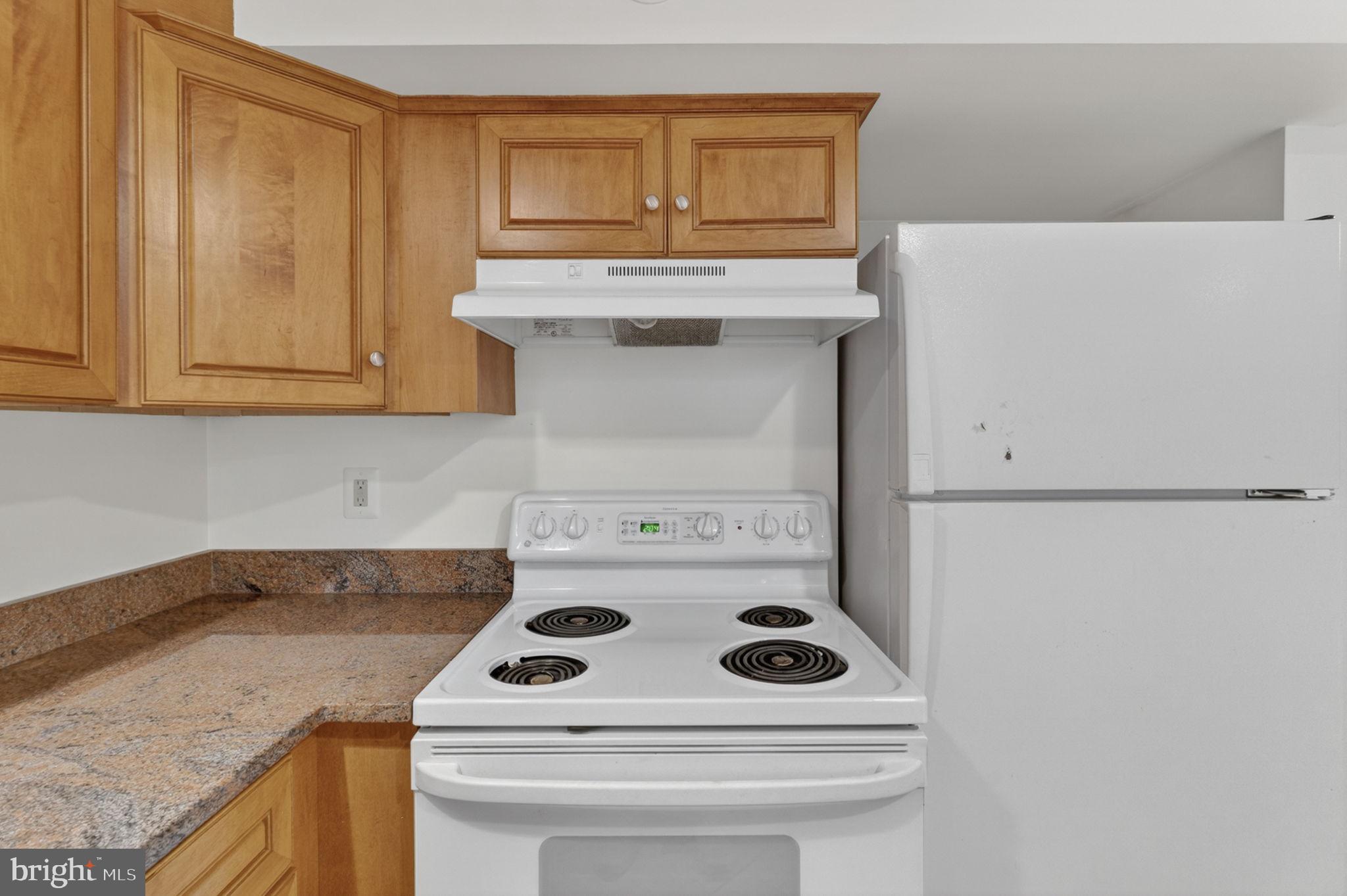 4531 Den Haag Road Warrenton, VA 20187 - Photo 68 of 103 a kitchen with a stove and a microwave
