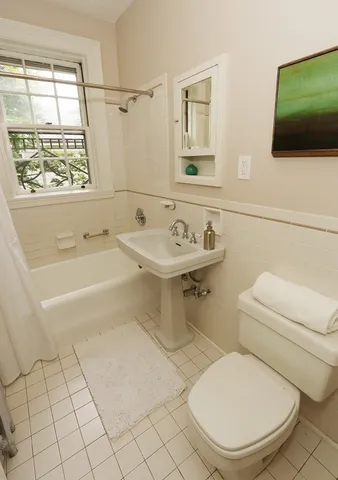 a bathroom with a toilet a sink and a bathtub