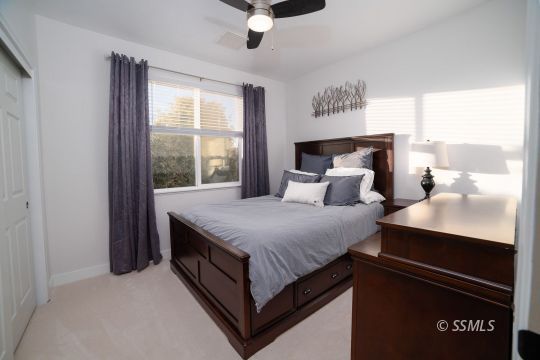 925 West Coronado Avenue Ridgecrest, CA 93555 - Photo 4 of 33 a bedroom with a bed and window