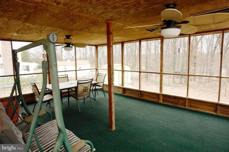 24408 Hanson Road Gaithersburg, MD 20882 - Photo 26 of 30 Screened In Porch overlooks the backyard.