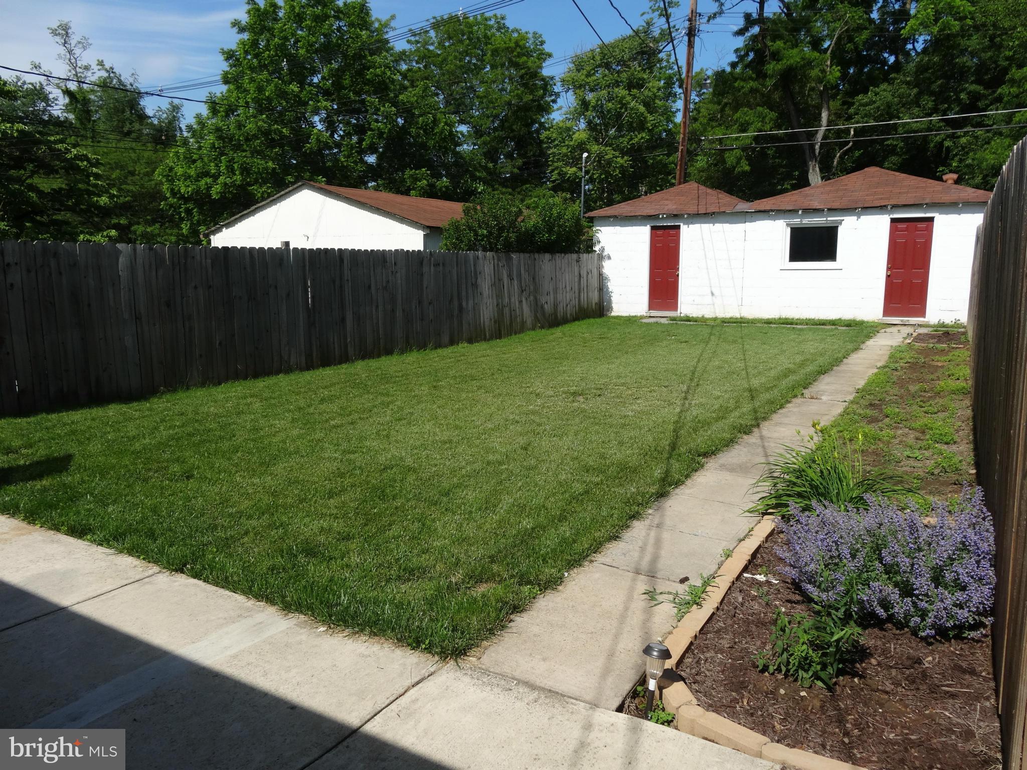 537 Ridge Avenue Hagerstown, MD 21740 - Photo 22 of 26 Fenced back yard with walkway to garage