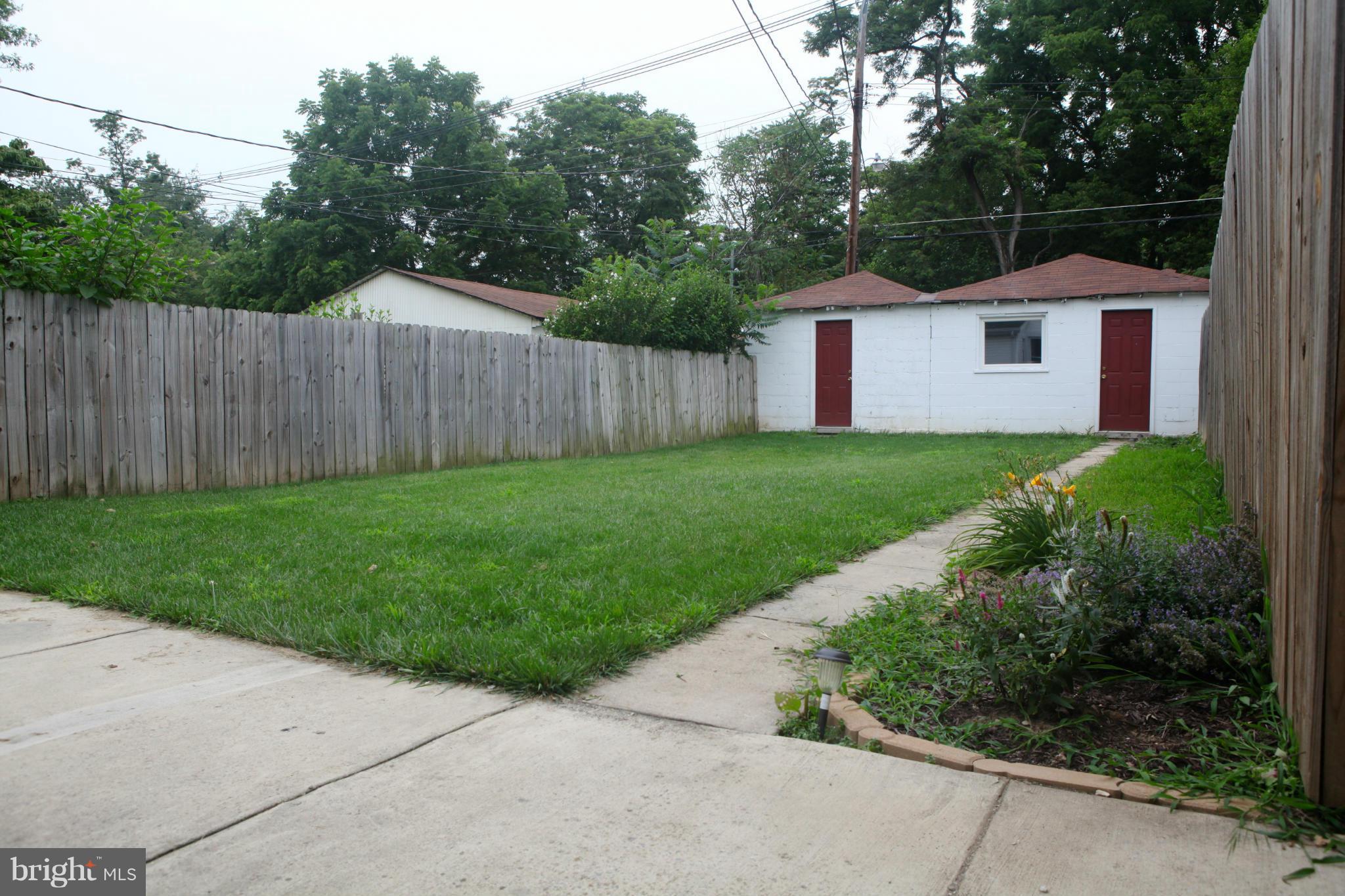 537 Ridge Avenue Hagerstown, MD 21740 - Photo 24 of 26 Fenced back yard with walkway to garage