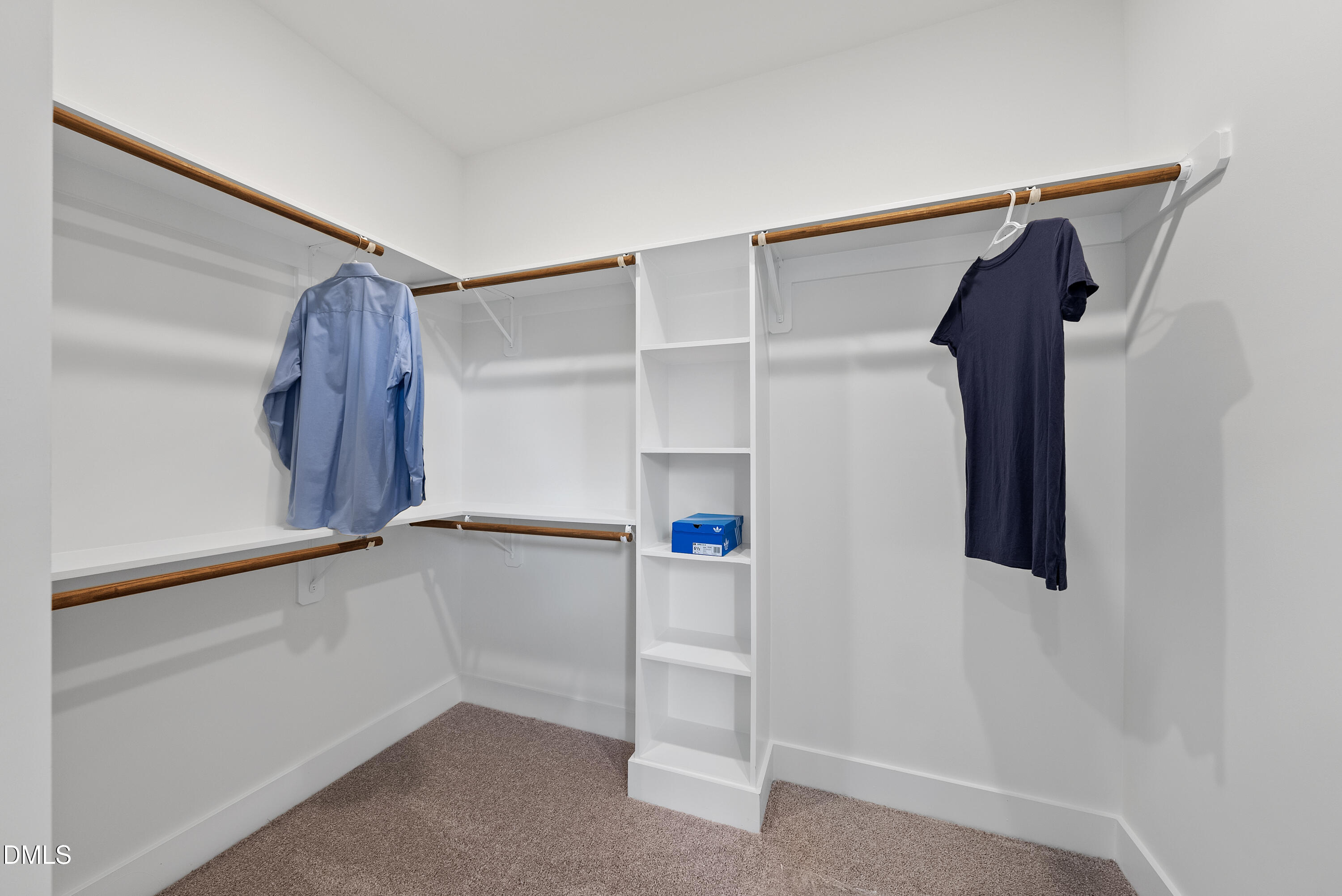 6786 Fire Tower Road Spring Hope, NC 27882 - Photo 17 of 30 a view of walk in closet with clothes
