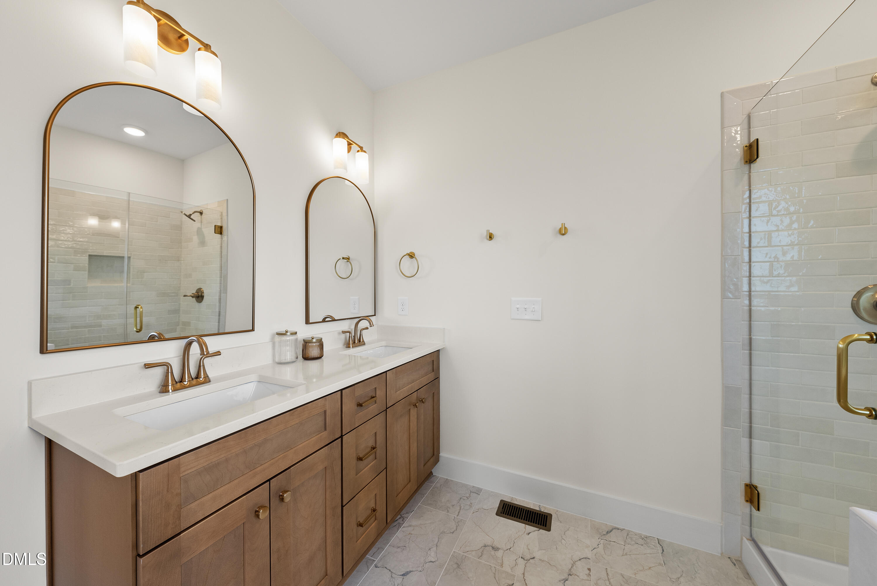 6786 Fire Tower Road Spring Hope, NC 27882 - Photo 18 of 30 a bathroom with a double vanity sink and a mirror