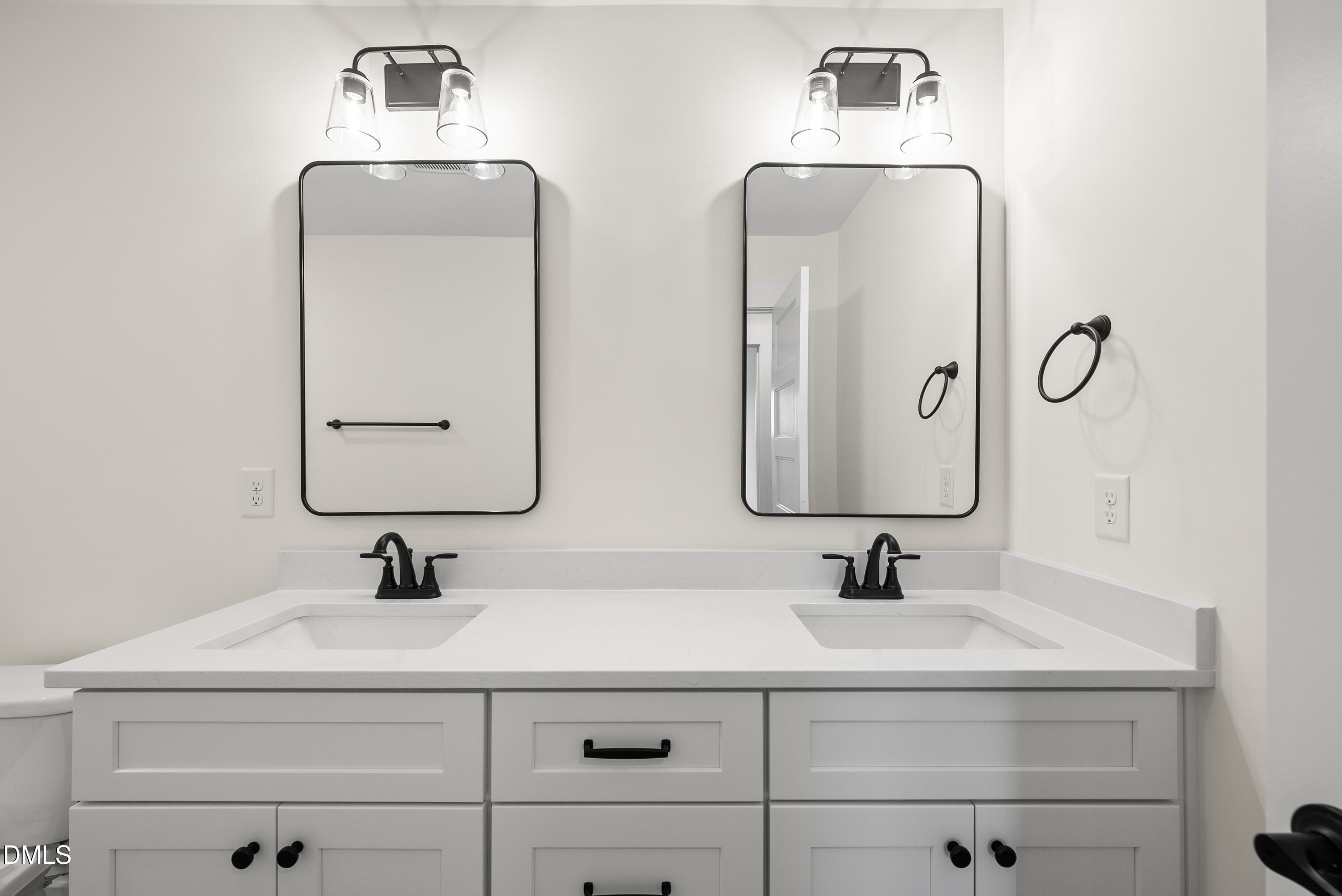 6786 Fire Tower Road Spring Hope, NC 27882 - Photo 22 of 30 a bathroom with double vanity sinks and a mirror