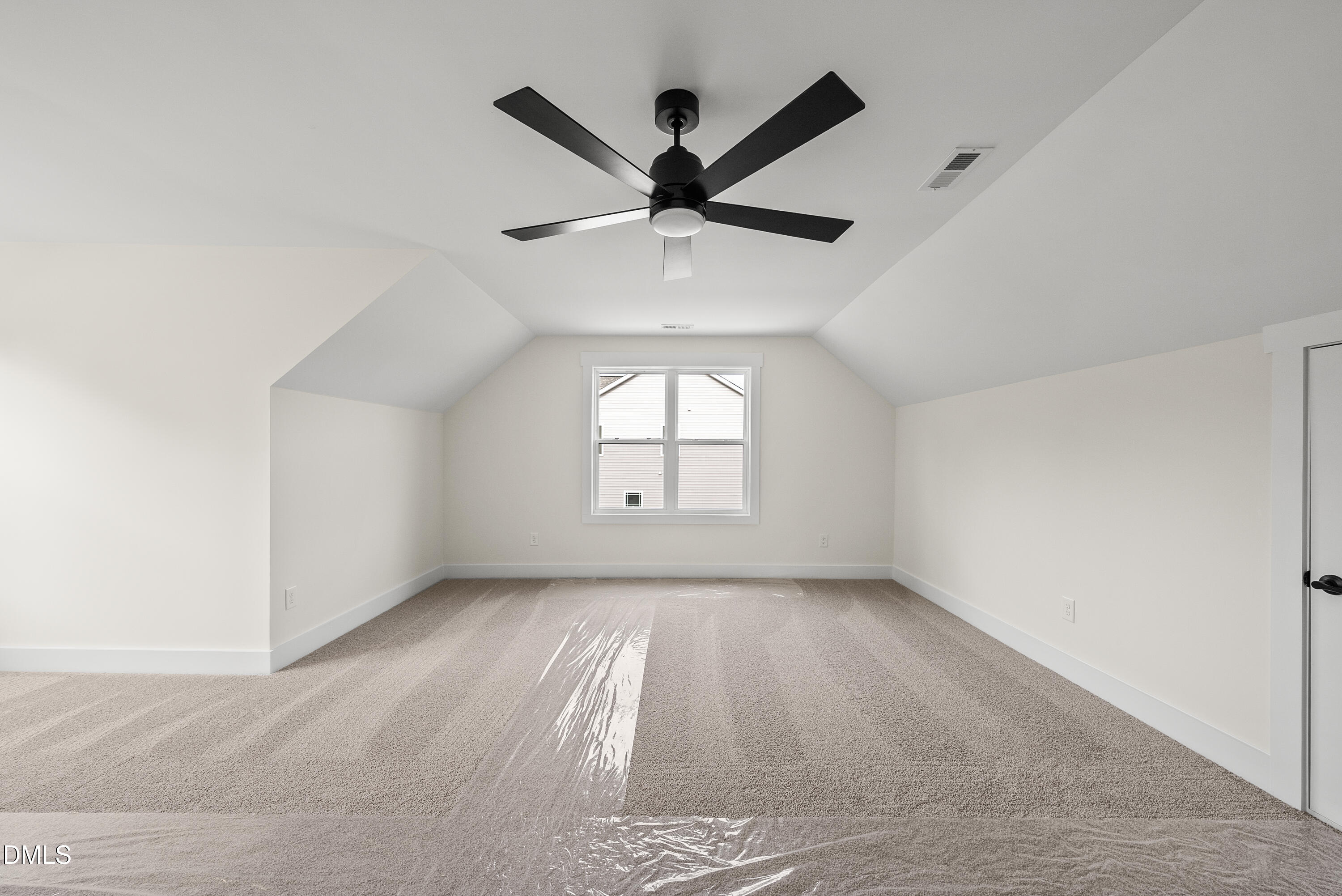 6786 Fire Tower Road Spring Hope, NC 27882 - Photo 25 of 30 an empty room with windows and ceiling fan