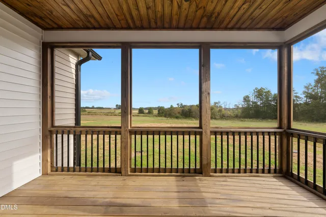 a view of a balcony with wooden floor