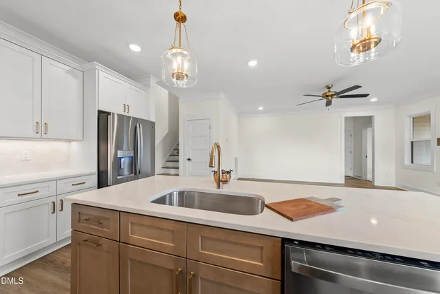 a kitchen with a sink and a refrigerator