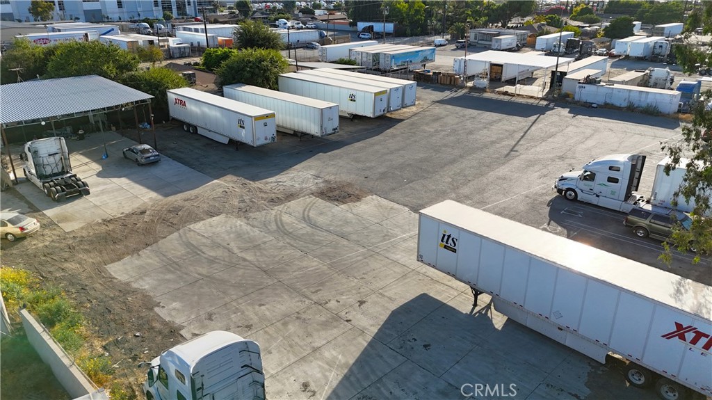 14770 Boyle Avenue Fontana, CA 92337 - Photo 14 of 26 a group of cars parked in front of a yard