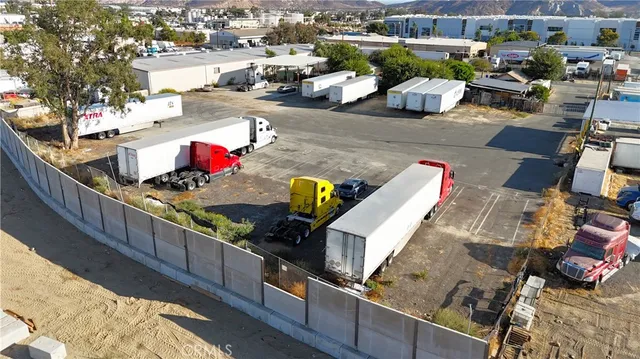 an aerial view of a house with outdoor space