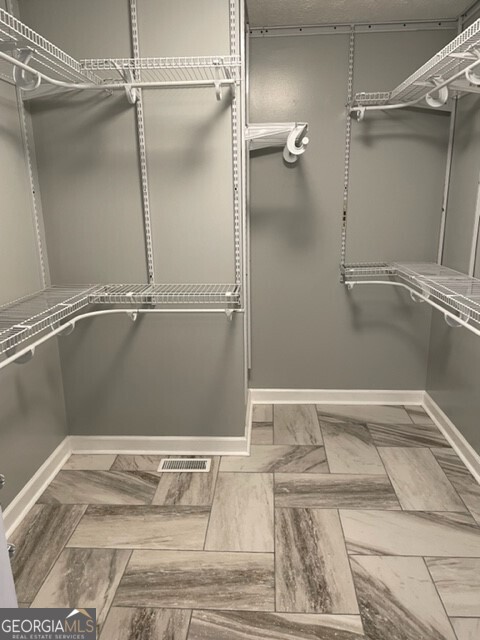 839 Sandy Creek Road Fayetteville, GA 30214 - Photo 11 of 22 a view of a walk in closet