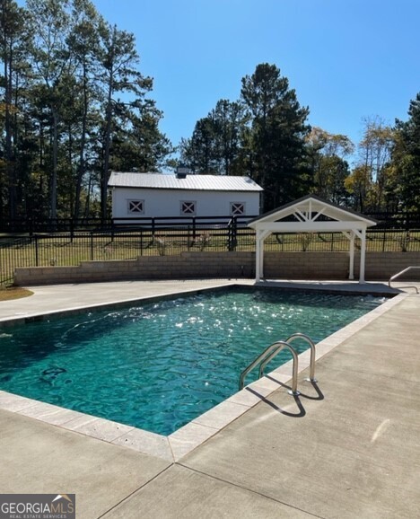 839 Sandy Creek Road Fayetteville, GA 30214 - Photo 15 of 22 a view of a house with a yard