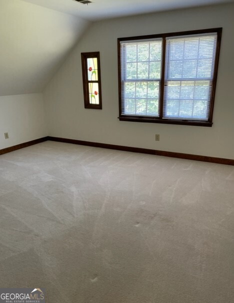 839 Sandy Creek Road Fayetteville, GA 30214 - Photo 17 of 22 an empty room with windows