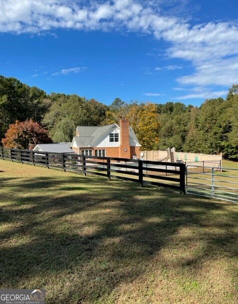 839 Sandy Creek Road Fayetteville, GA 30214 - Photo 2 of 22 a view of a lake with houses in the back