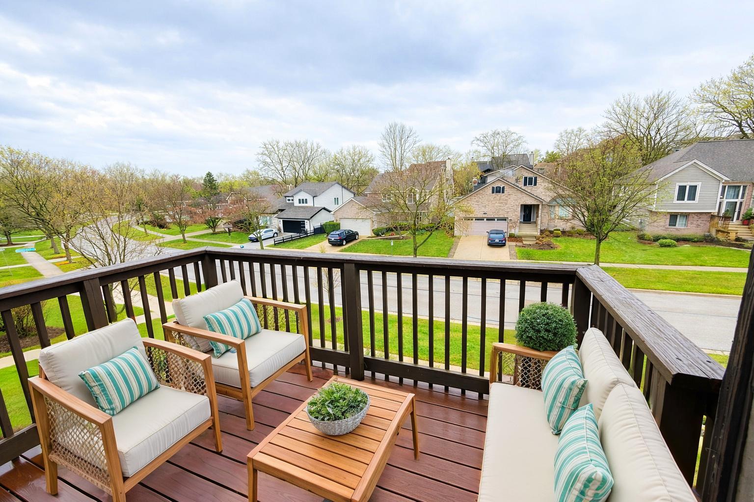 1462 Stonebridge Circle, Unit F10 Wheaton, IL 60189 - Photo 5 of 19 a view of a chair in wooden deck