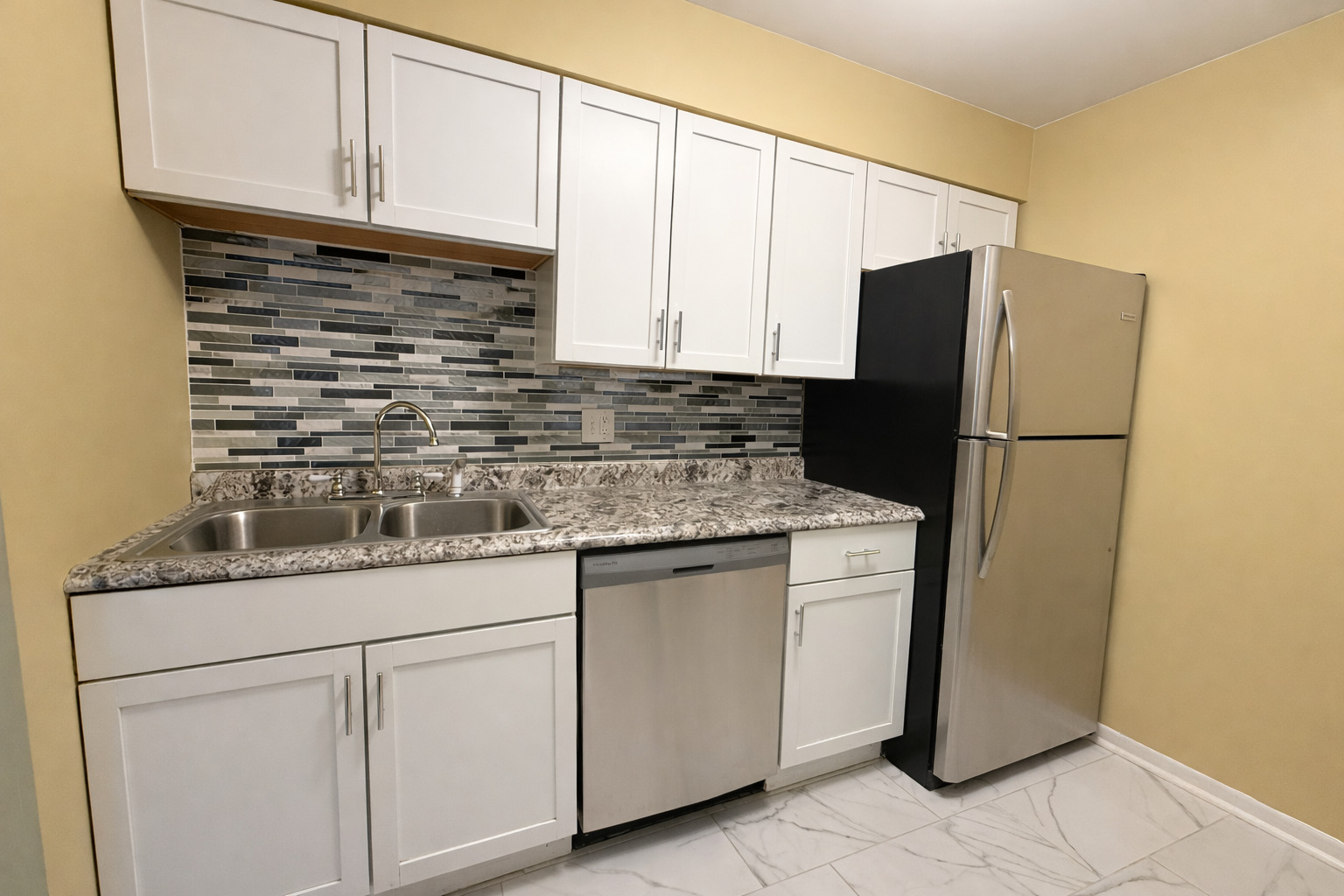 1462 Stonebridge Circle, Unit F10 Wheaton, IL 60189 - Photo 7 of 19 a kitchen with appliances cabinets and a counter top