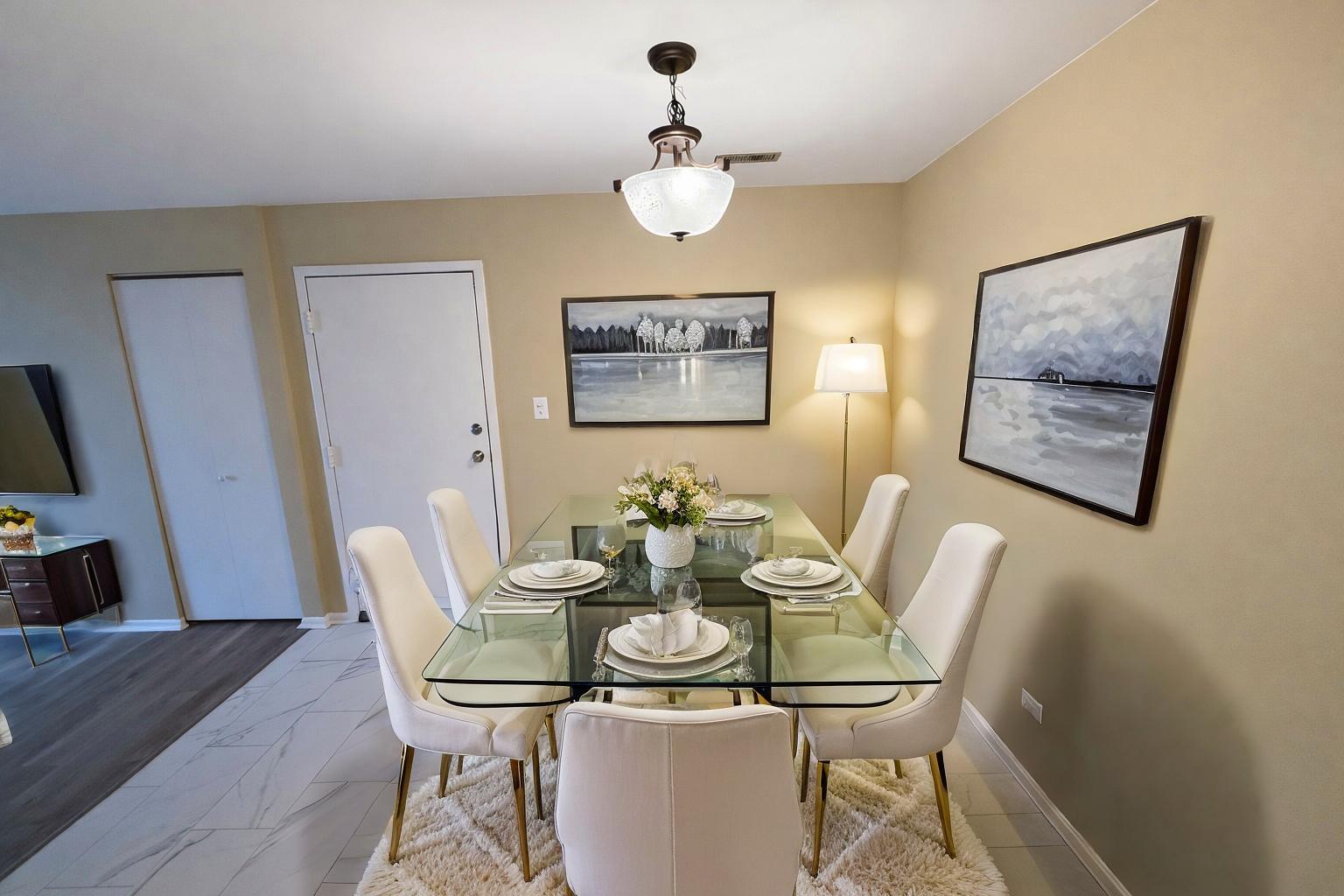 1462 Stonebridge Circle, Unit F10 Wheaton, IL 60189 - Photo 9 of 19 a view of a dining room with furniture and wooden floor