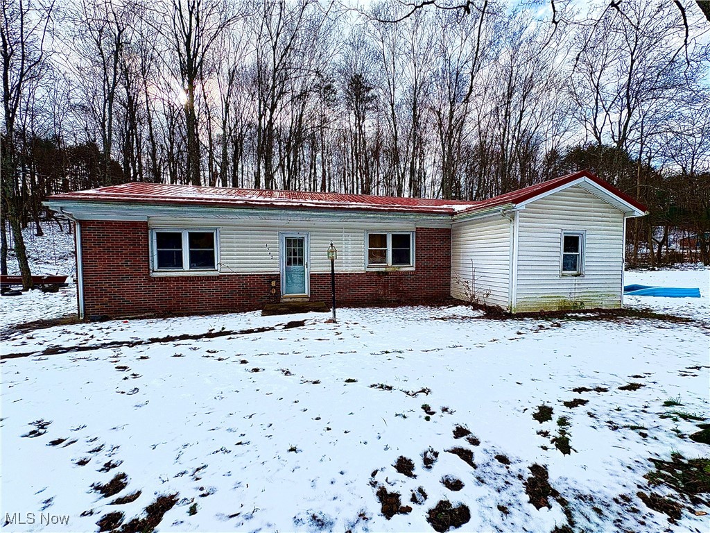 4542 Bloomfield Road Cambridge, OH 43725 - Photo 2 of 22 View of front facade with brick siding