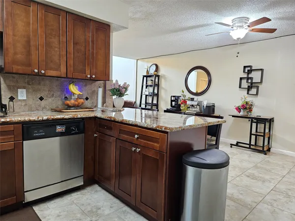 a kitchen with a sink cabinets and appliances