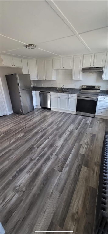 133 Mendon Street, Unit B Uxbridge, MA 01569 - Photo 1 of 8 a large white kitchen with kitchen island white cabinets and stainless steel appliances