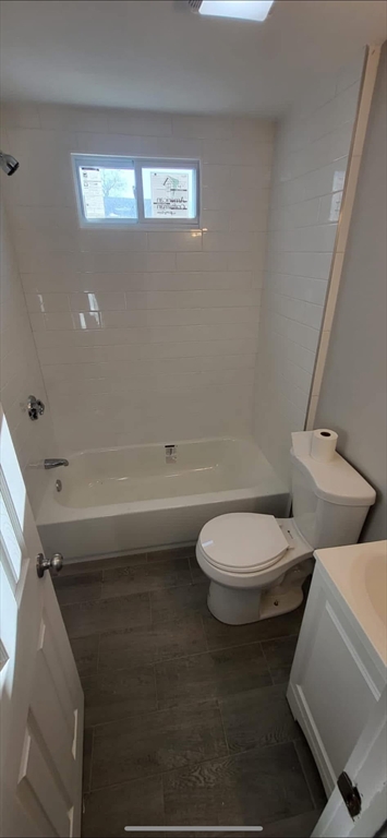 133 Mendon Street, Unit B Uxbridge, MA 01569 - Photo 3 of 8 a bathroom with a toilet a sink and mirror