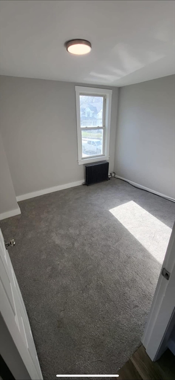 133 Mendon Street, Unit B Uxbridge, MA 01569 - Photo 4 of 8 a view of an empty room with a window