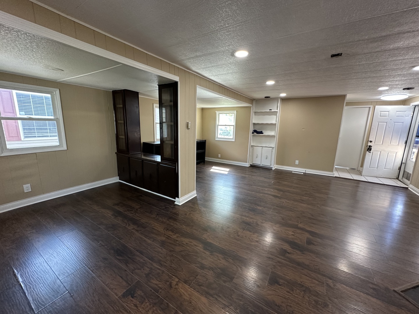 180 North Windmere Circle Matteson, IL 60443 - Photo 3 of 32 a view of an empty room with wooden floor and a window