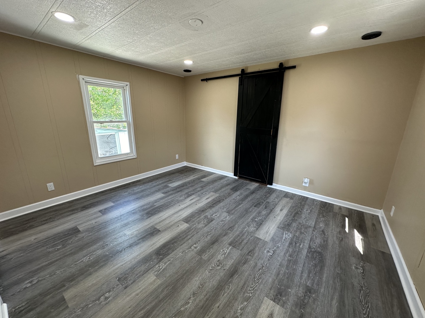 180 North Windmere Circle Matteson, IL 60443 - Photo 6 of 32 an empty room with wooden floor and windows