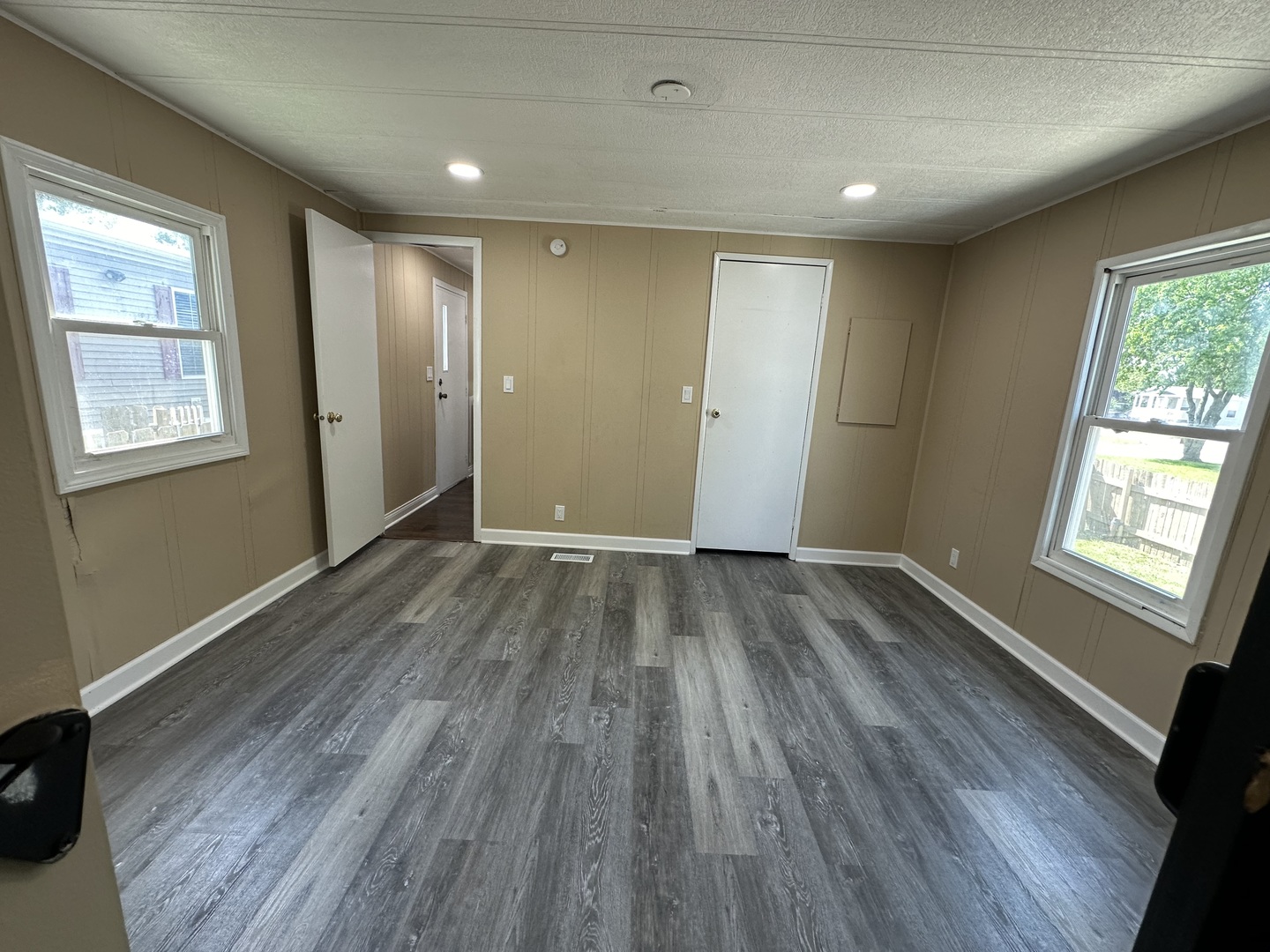 180 North Windmere Circle Matteson, IL 60443 - Photo 7 of 32 a view of an empty room with wooden floor and a window
