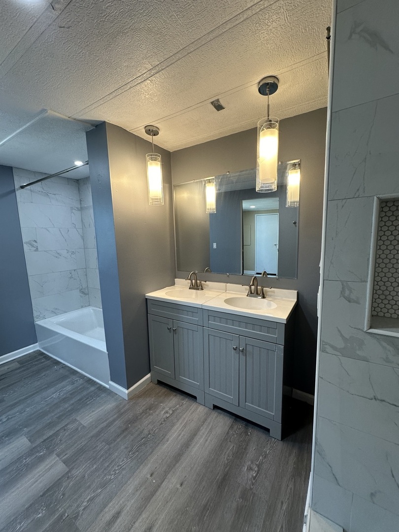 180 North Windmere Circle Matteson, IL 60443 - Photo 10 of 32 a bathroom with a double vanity sink and a mirror