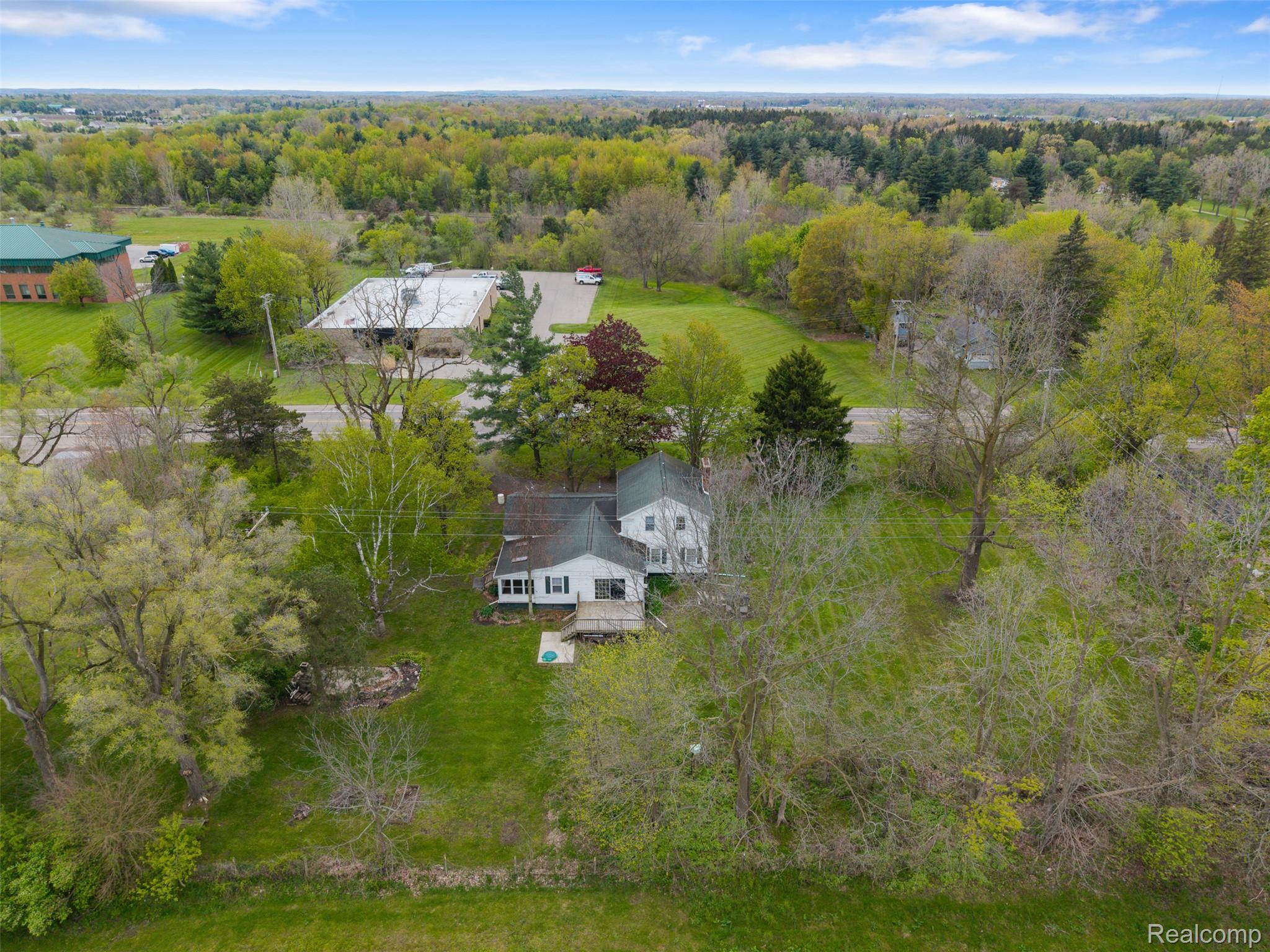 1775 Imlay City Road Lapeer, MI 48446 - Photo 55 of 60 View of subject property featuring a forest